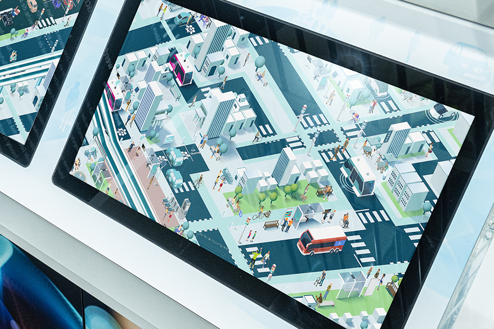 Ein Bildschirm zeigt eine digitale Stadt aus der Vogelperspektive